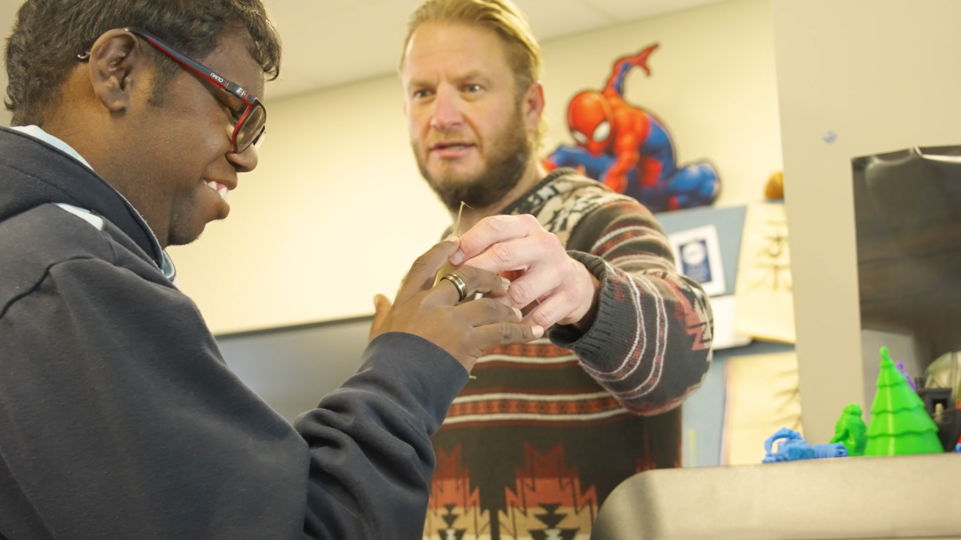 Vision impaired students feeling a 3D printed object.